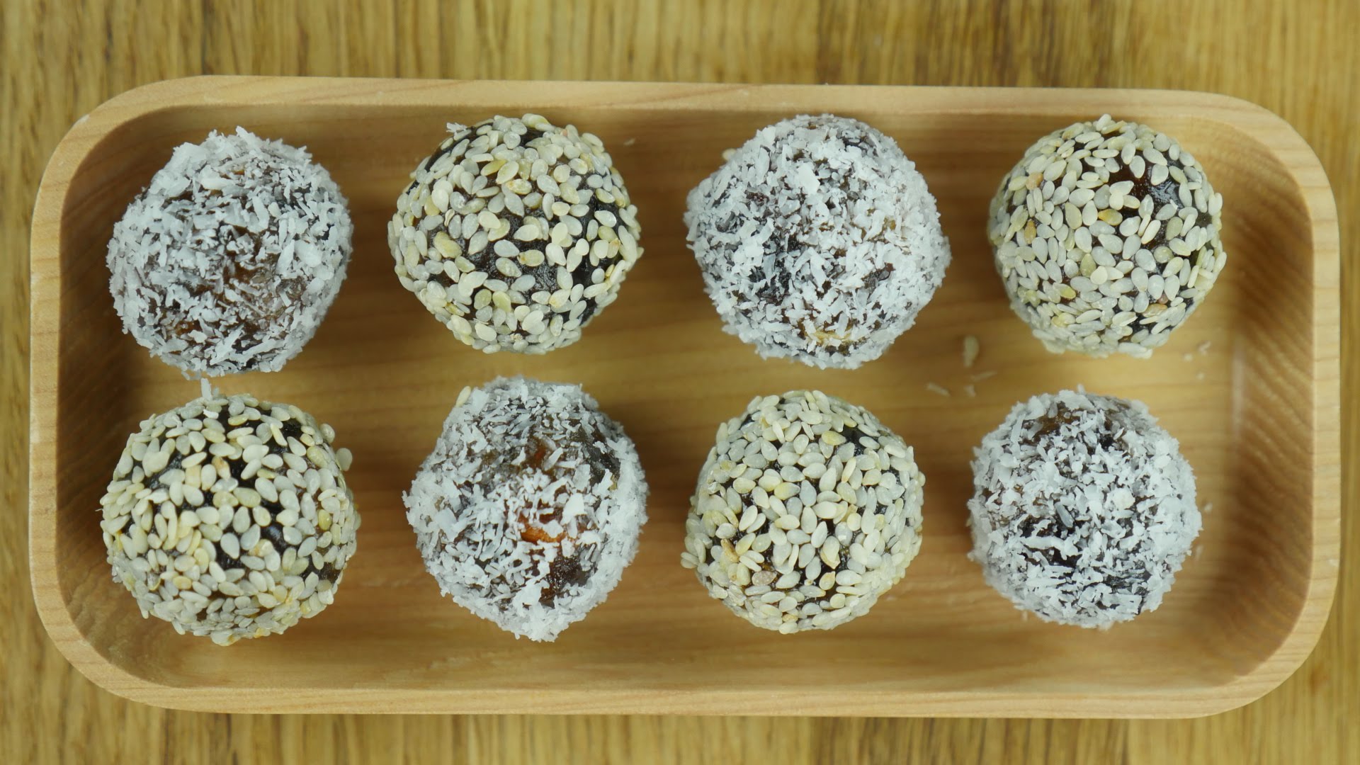 Khajoor Balls (dates) coated with coconut and sesame seeds- Food Fusion