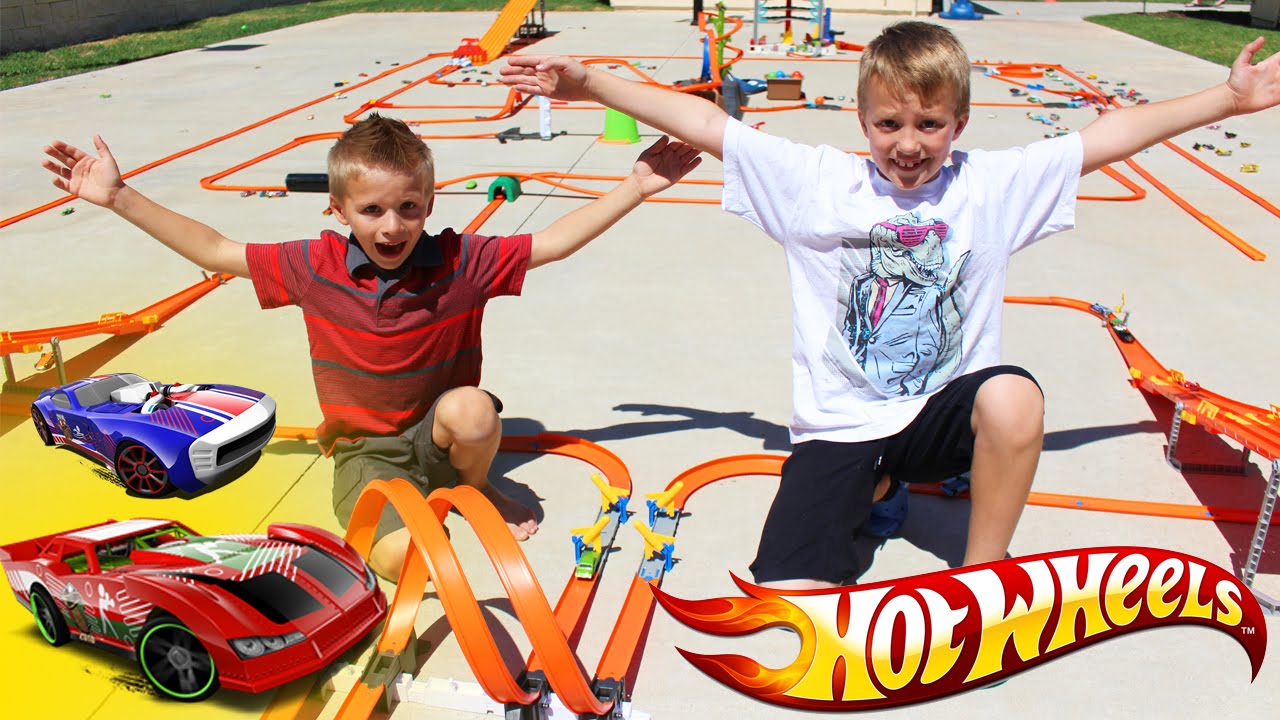 Race Cars VS City Cars in a HUGE AWESOME HOT WHEELS TRACK