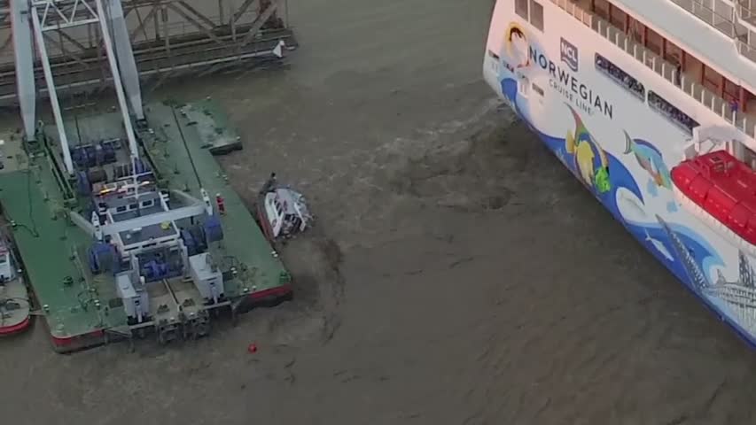 Tug boat pushed under water by cruise ship