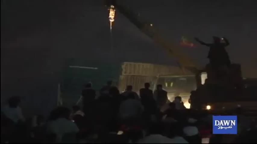 PTI protesters trying to remove containers using cranes
